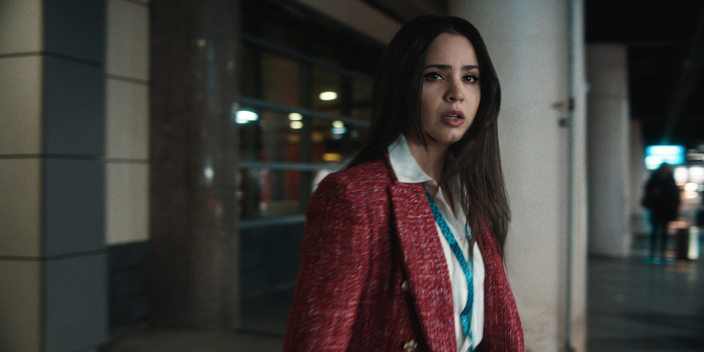 Carry-On - Sofia Carson as Nora Parisi