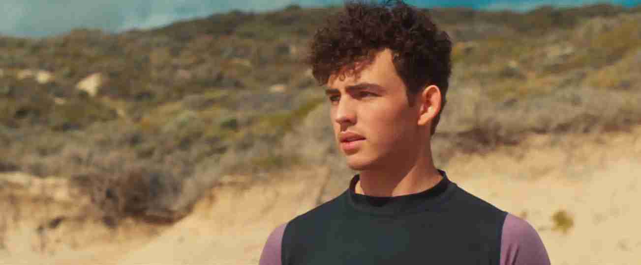 The Surfer - Finn Little on a Beach