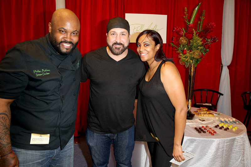 Singer/TV personality Joey Fatone (center) poses with chocolatier Phillip Anthony (L) at the Grammy Gift Lounge.