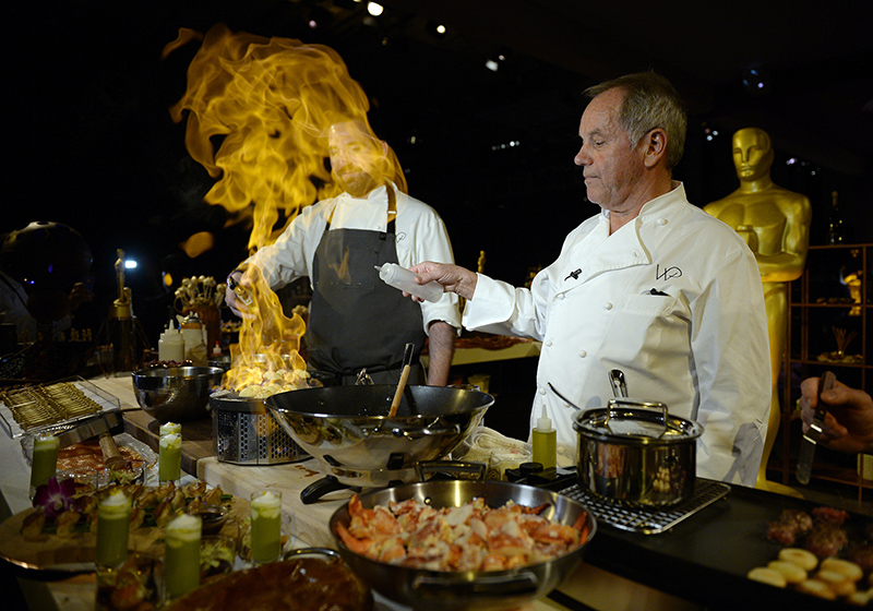 Celebrity chef Wolfgang Puck (C) showcased a sample of the big night's menu.