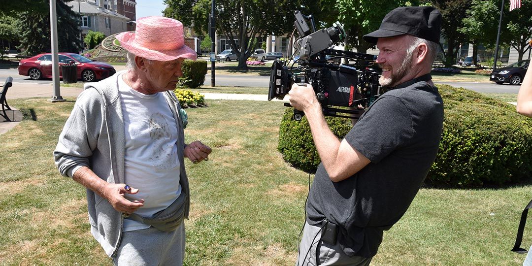 Udo Kier as Mr. Pat and director Todd Stephens on the set of 'Swan Song'