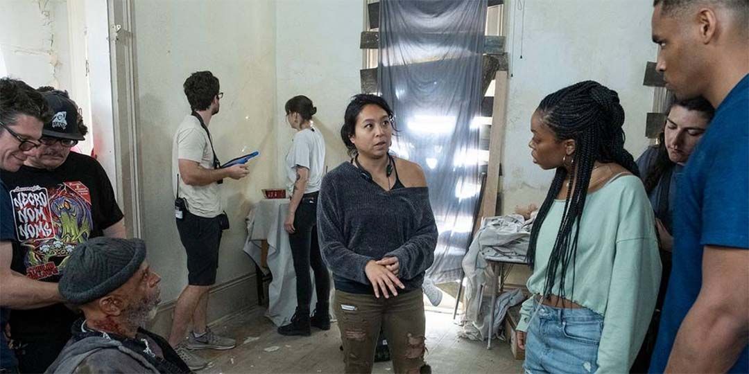 Maritte Lee Go (center) talks to Asjha Cooper (right) on the set of 'Black As Night'