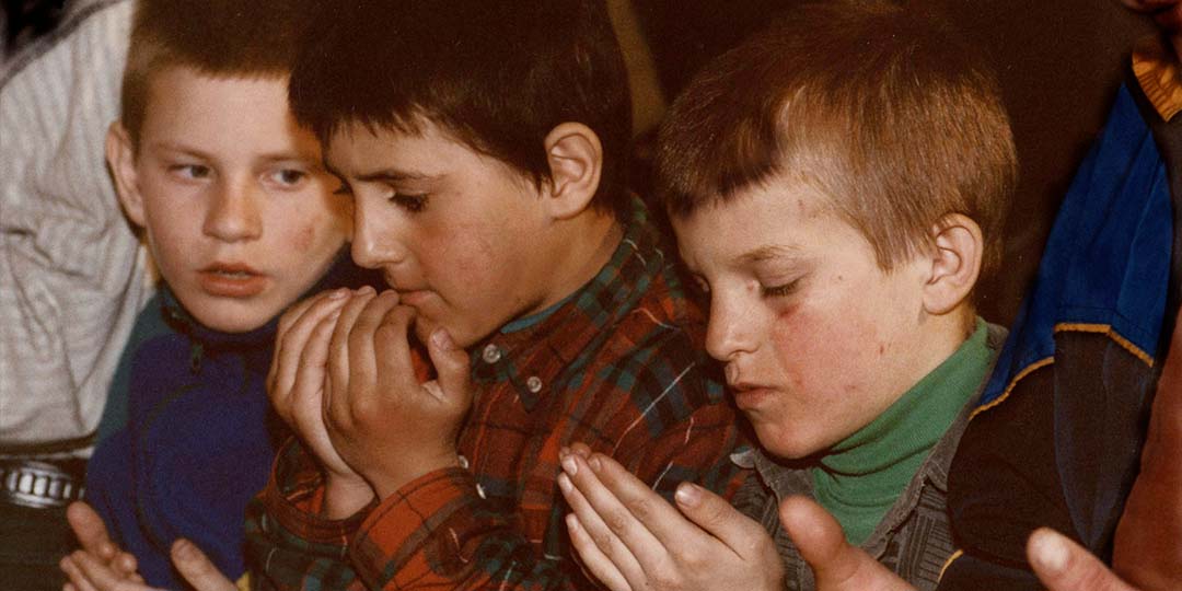 Boys pray at the Zihr ceremony in Ingushetia in 'The 3 Rooms of Melancholia,' directed by Pirjo Honkasalo