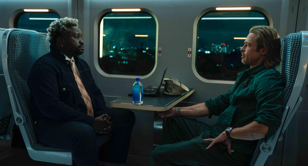 Brian Tyree Henry and Brad Pitt on a train