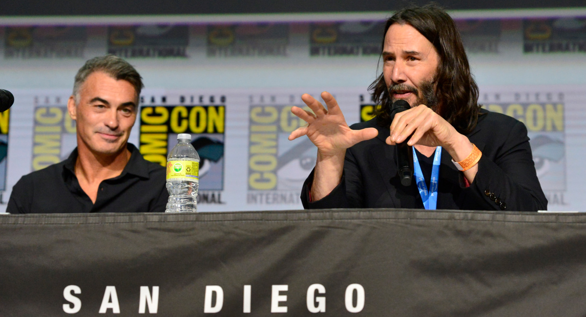 Chad Stahelski and Keanu Reeves speak onstage at Comic-Con at San Diego Convention Center