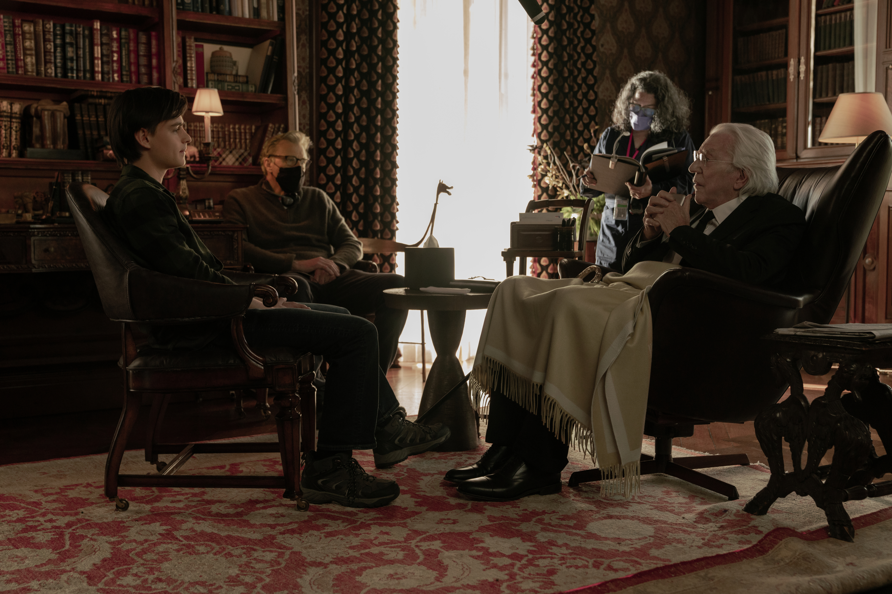 Jaeden Martell as Craig, director John Lee Hancock and Donald Sutherland as Mr. Harrigan in 'Mr. Harrigan’s Phone.'