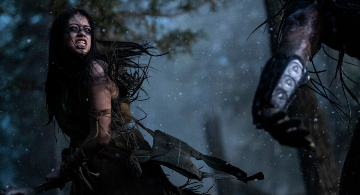 Amber Midthunder as Naru and Dane DiLiegro as the Predator in 20th Century Studios' 'Prey.'