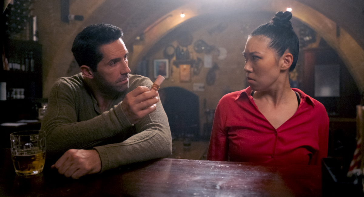 Scott Adkins as Mike Fallon and Sarah Chang as Wong Siu-ling in the action/thriller film, 'Accident Man: Hitman's Holiday.'