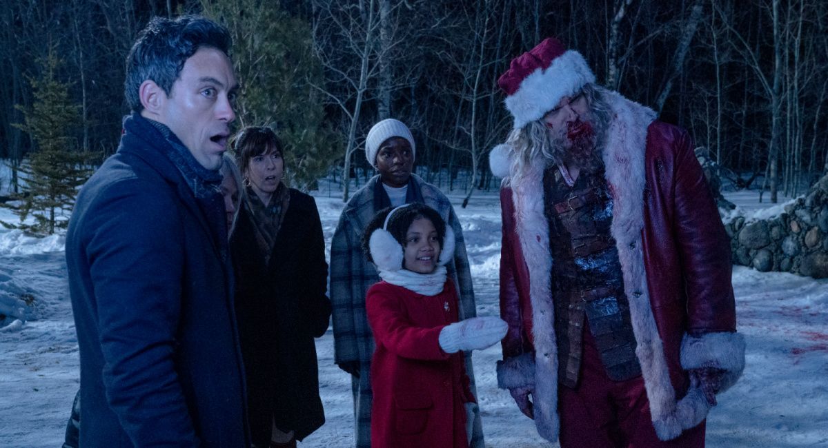 Jason (Alex Hassell), Gertrude (Beverly D’Angelo), Alva (Edi Patterson), Linda (Alexis Louder), Trudy (Leah Brady) and Santa (David Harbour) in 'Violent Night.'