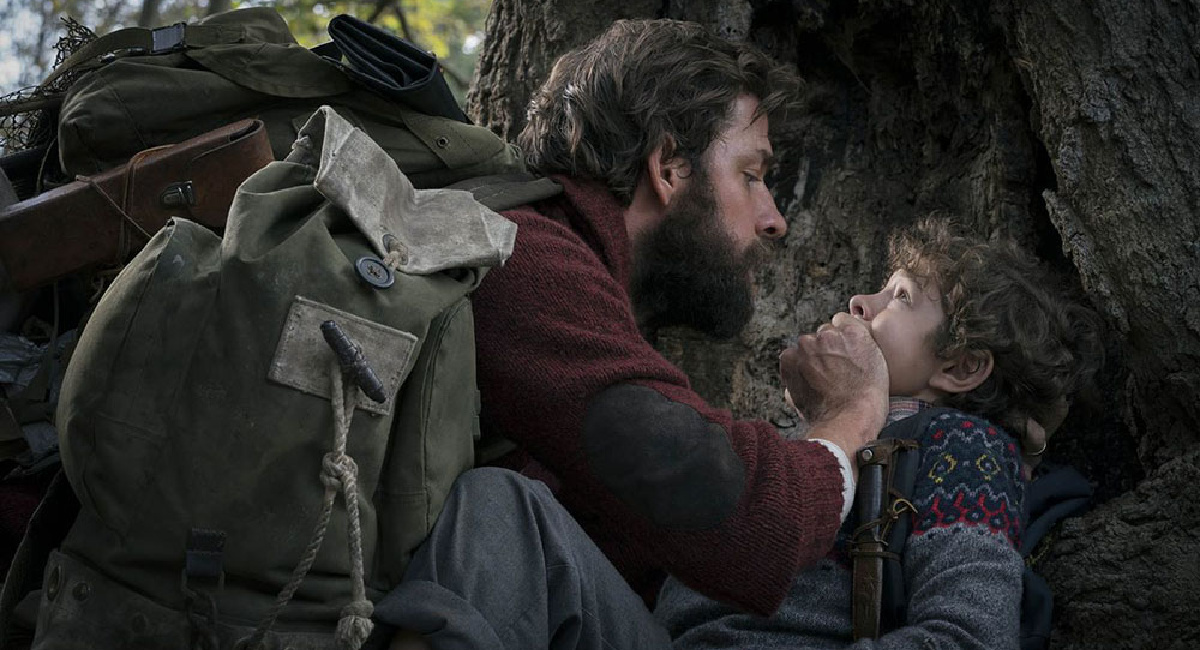 John Krasinski as Lee Abbott, and Noah Jupe as Marcus Abbott in 'A Quiet Place.'