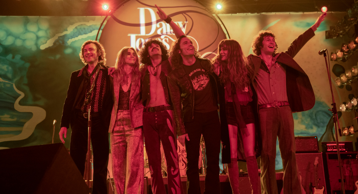Josh Whitehouse (Eddie Roundtree), Suki Waterhouse (Karen Sirko), Sebastian Chacon (Warren Rhodes), Sam Claflin (Billy Dunne), Riley Keough (Daisy Jones), and Will Harrison (Graham Dunne) star in Prime Video's 'Daisy Jones and The Six.'
