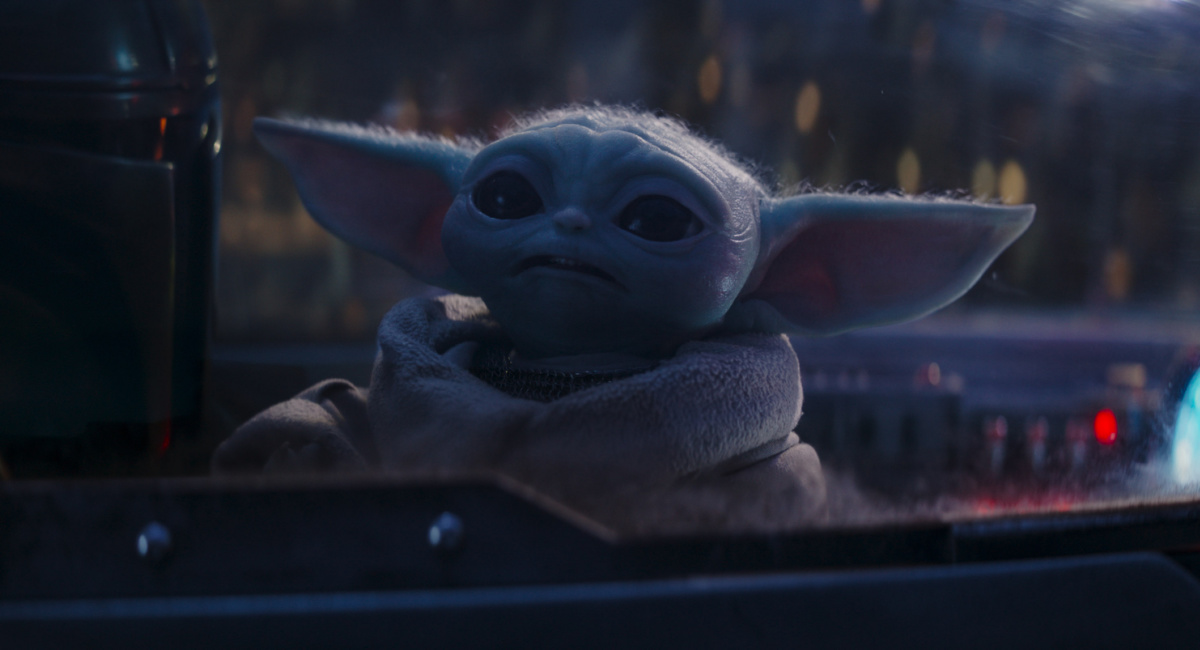 Din Djarin (Pedro Pascal) and Grogu in Lucasfilm's 'The Mandalorian,' season three, exclusively on Disney+.