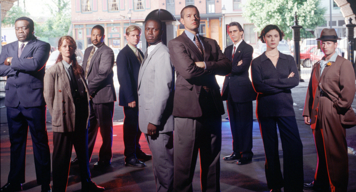 Yaphet Kotto as Lieutenant Al Giardello, Melissa Leo as Detective/Sergeant Kay Howard, Clark Johnson as Detective Meldrick Lewis, Reed Diamond as Detective Mike Kellerman, Andre Braugher as Detective Frank Pembleton, Kyle Secor as Detective Tim Bayliss, Richard Belzer as Detective John Munch, Michelle Forbes as Dr. Julianna Cox, and Max Perlich as J.H. Brodie in NBC's 'Homicide: Life on the Street.'