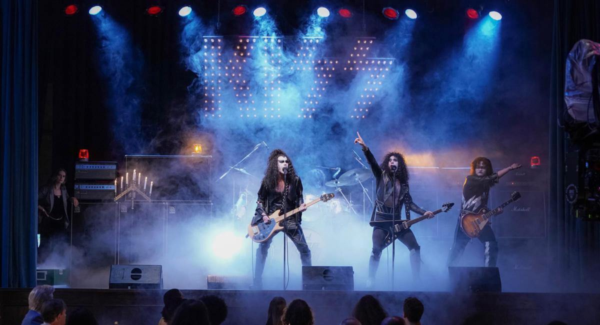Casey Likes as Gene Simmons, Sam Harris as Paul Stanley and Alex Gaskarth as Peter Criss performing as Kiss in 'Spinning Gold.'