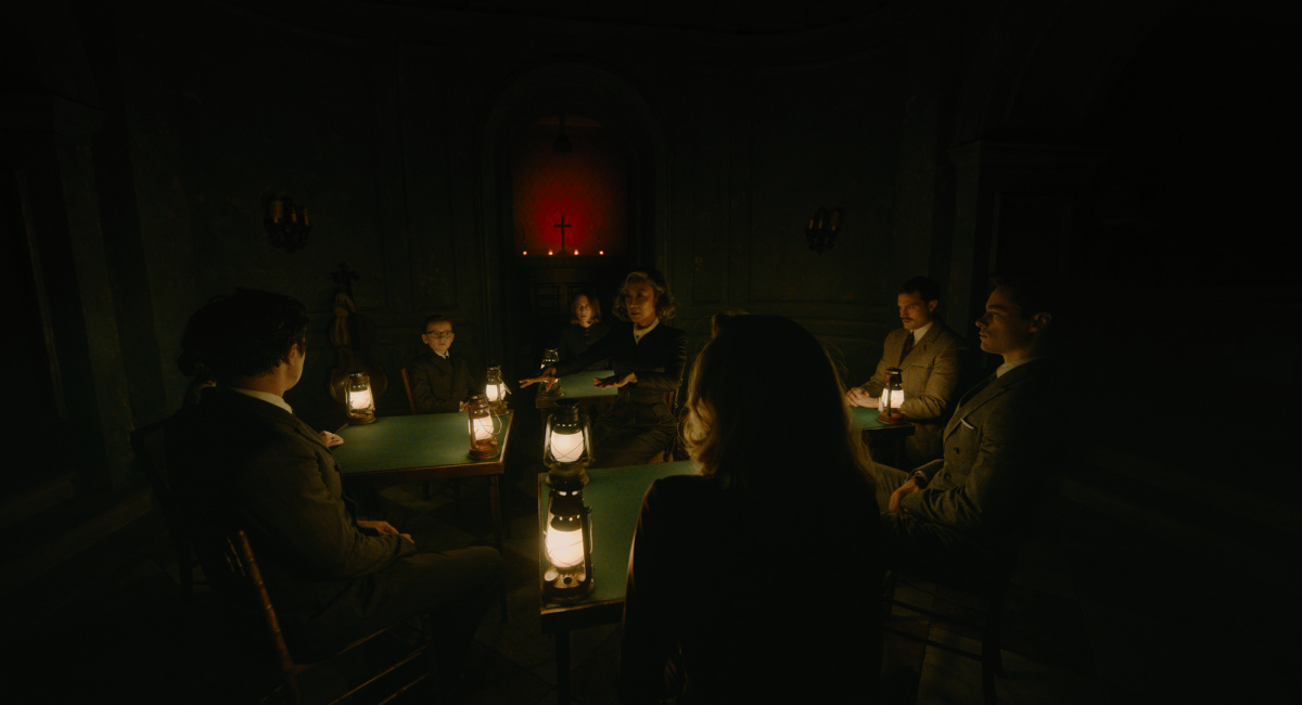 Jude Hill as Leopold Ferrier, Camille Cottin as Olga Seminoff, Michelle Yeoh as Mrs. Reynolds, Jamie Dornan as Dr. Leslie Ferrier, and Kyle Allen as Maxime Gerard in 20th Century Studios' 'A Haunting in Venice.'