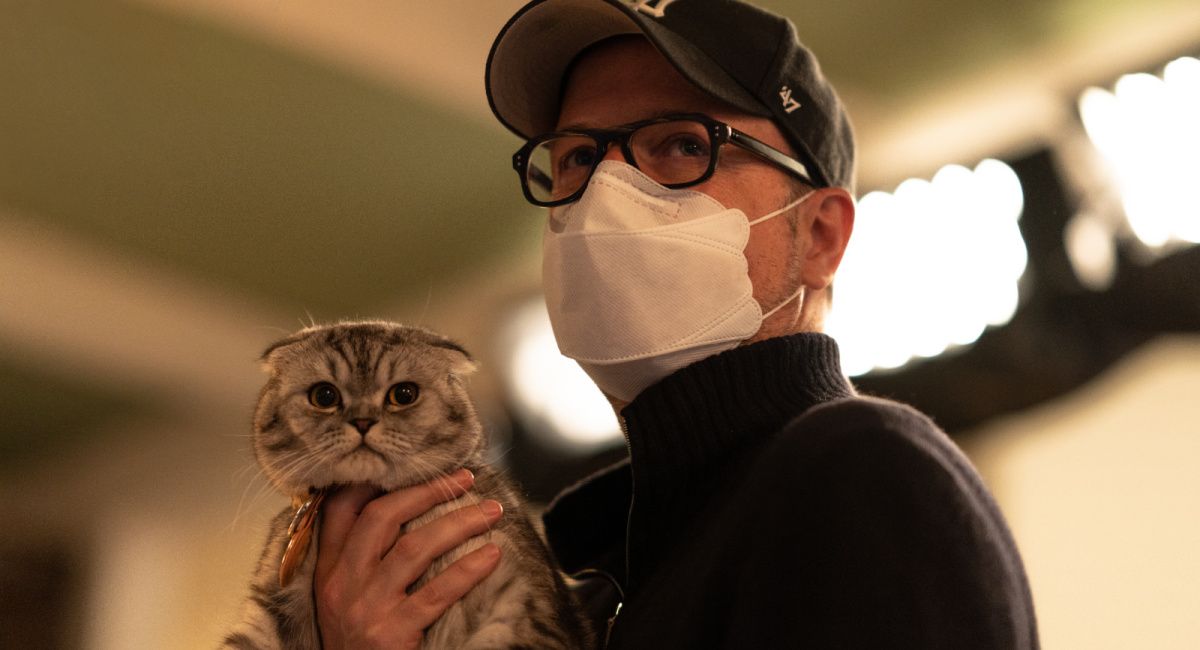 Director Matthew Vaughn with Chip the cat (playing Alfie) on the set of 'Argylle.'