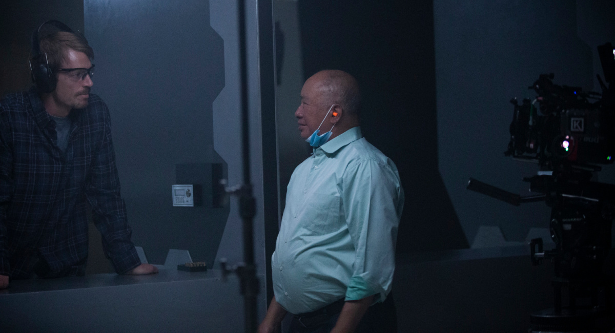 Joel Kinnaman and director John Woo on the set of 'Silent Night.'