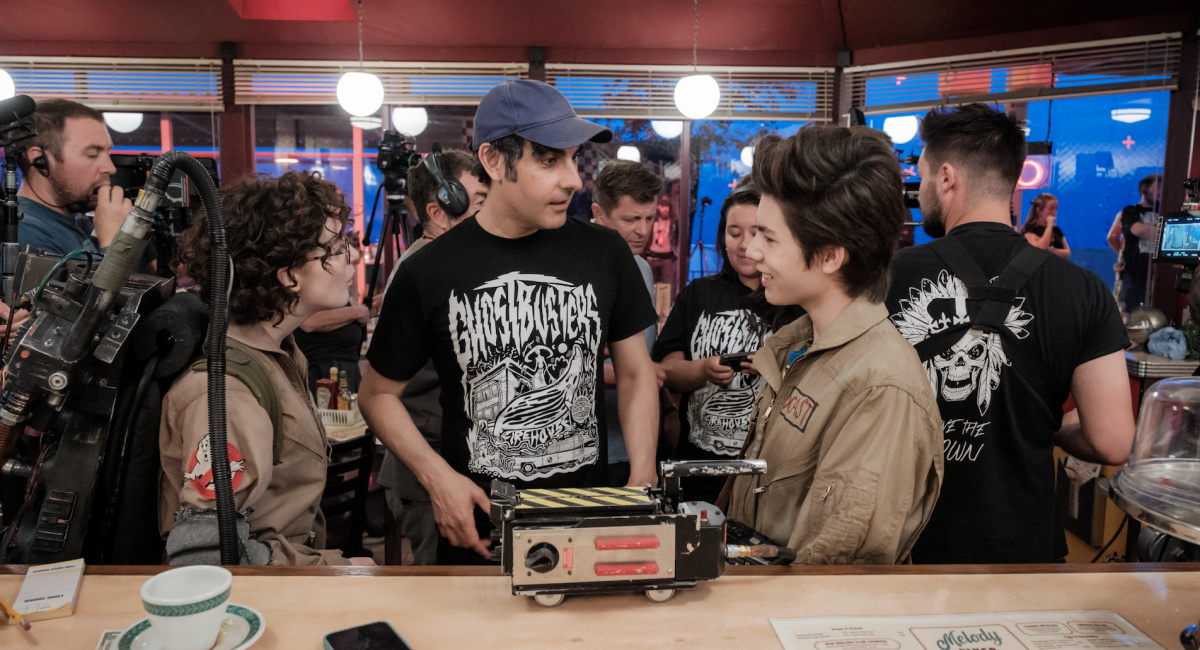 Mckenna Grace, Director Gil Kenna and Logan Kim on the set of Columbia Pictures’ 'Ghostbusters: Frozen Empire.'