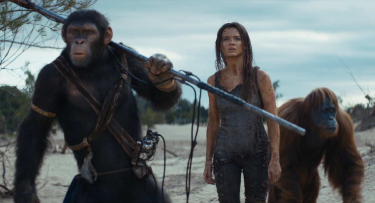 Noa (played by Owen Teague), Freya Allan as Nova and Raka (played by Peter Macon) in 20th Century Studios' 'Kingdom of the Planet of the Apes.'