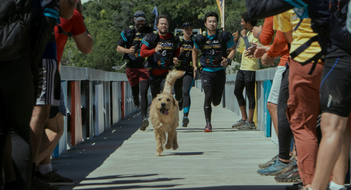 (L to R) Mark Wahlberg as Michael and Simu Liu as Leo in 'Arthur The King.'