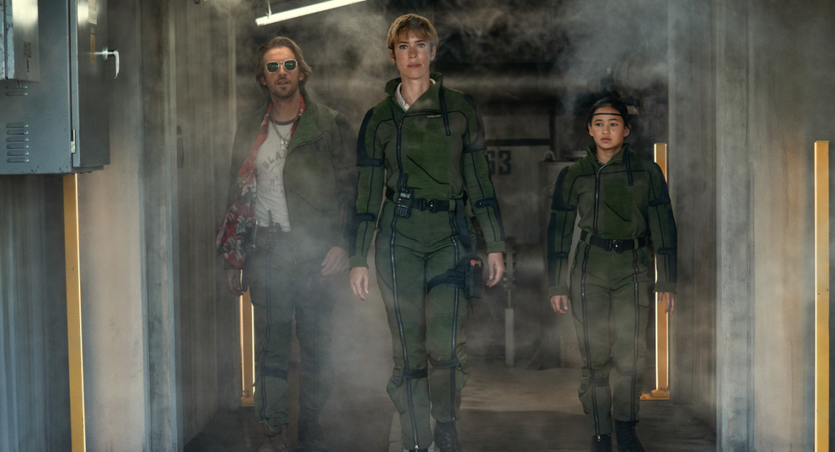 Dan Stevens as Trapper, Rebecca Hall as Dr. Ilene Andrews and Kaylee Hottle as Jia in Warner Bros. Pictures and Legendary Pictures’ action adventure 'Godzilla x Kong: The New Empire,' a Warner Bros. Pictures release.
