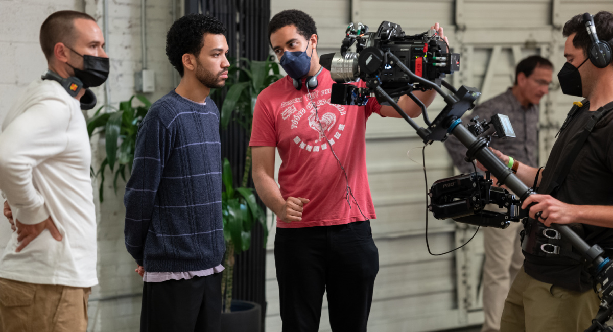 Director of photography Doug Emmett, actor Justice Smith and writer/director Kobi Libii on the set of 'The American Society of Magical Negroes,' a Focus Features release.