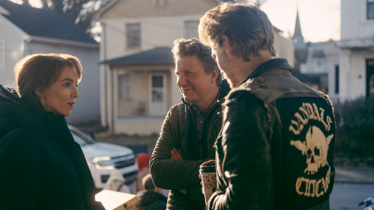 Jodie Comer stars as Kathy, director Jeff Nichols and Austin Butler as Benny on the set of 'The Bikeriders,' a Focus Features release.