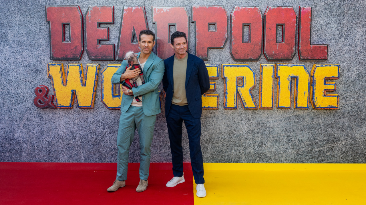 Ryan Reynolds, Peggy aka "Dogpool" and Hugh Jackman attend the UK Fan Event of Marvel Studios' 'Deadpool & Wolverine' at Eventim Apollo, London on July 11th, 2024.