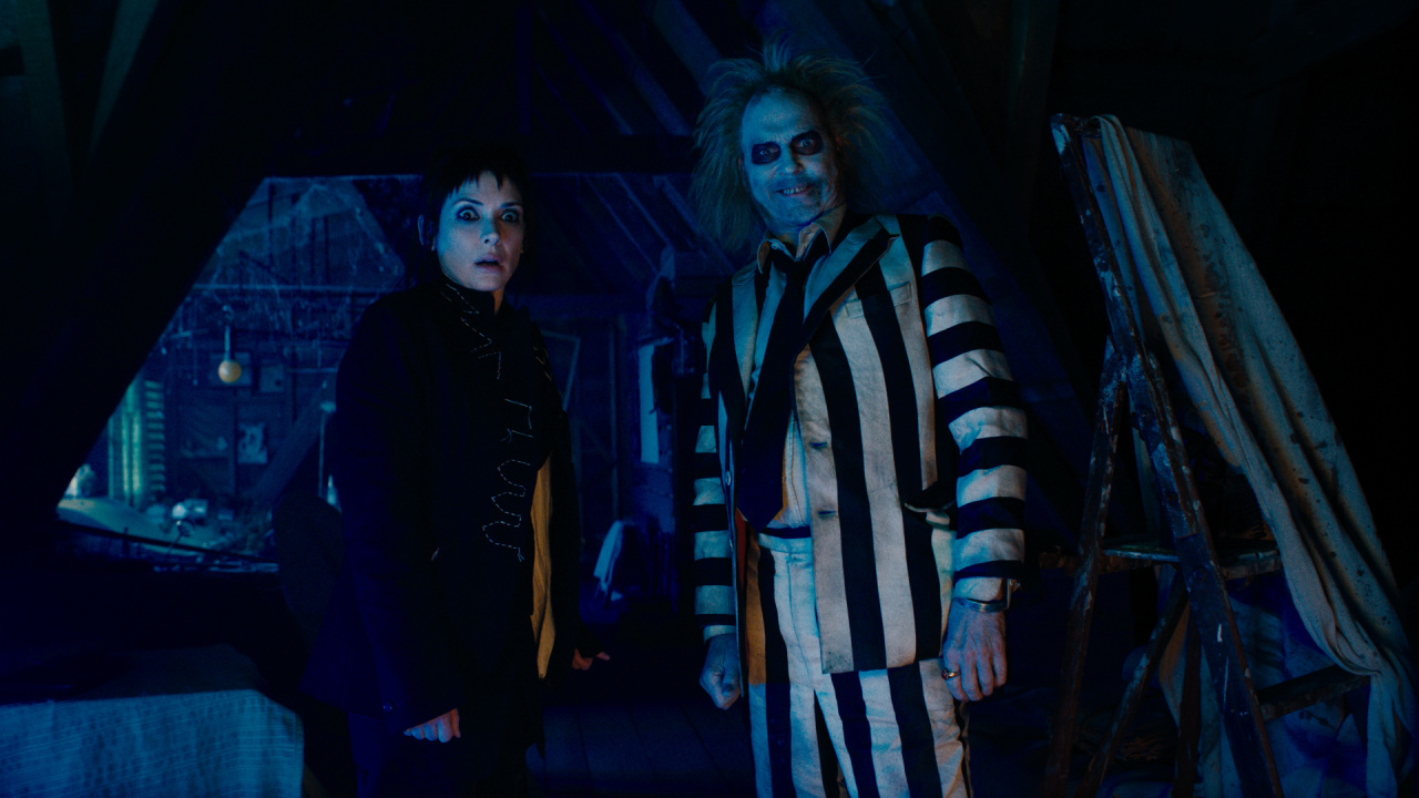 (L to R) Winona Ryder as Lydia and michael Keaton as Beetlejuice in Warner Bros. Pictures’ comedy, 'Beetlejuice Beetlejuice', a Warner Bros. Pictures release. Photo Credit: Courtesy of Warner Bros. Pictures. Copyright: © 2024 Warner Bros. Entertainment Inc. All Rights Reserved.