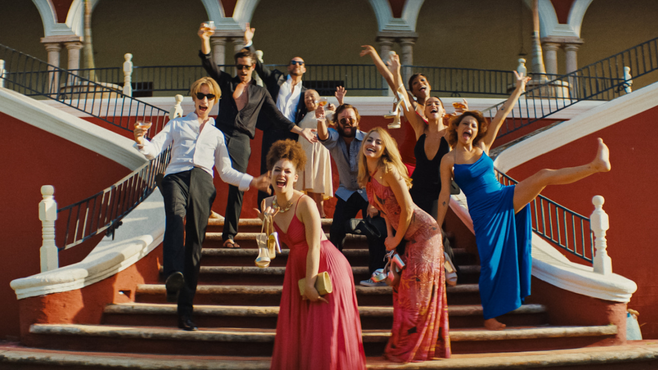 (L to R) Levon Hawke stars as Lucas, Simon Rex as Cody, Liz Caribel as Camilla, Channing Tatum as Slater King, Haley Joel Osment as Tom, Trew Mullen as Heather, Naomi Ackie as Frida, Adria Arjona as Sarah and Alia Shawkat as Jess in director Zoë Kravitz's 'Blink Twice', an Amazon MGM Studios film. Photo credit: Courtesy of Amazon MGM Studios © 2024 Amazon Content Services LLC. All Rights Reserved.