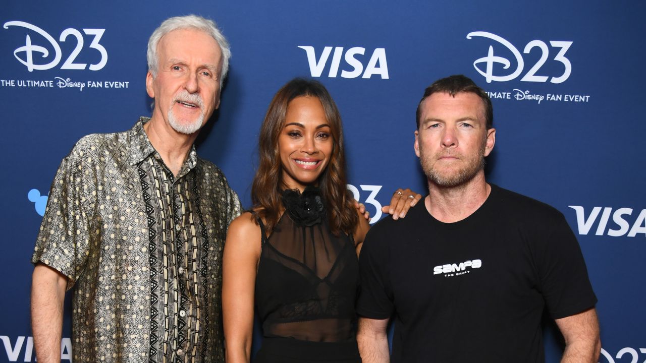 (L to R) Director James Cameron, Zoe Saldaña and Sam Worthington at D23 2024 presenting 'Avatar: Fire and Ash'. Photo: Disney.