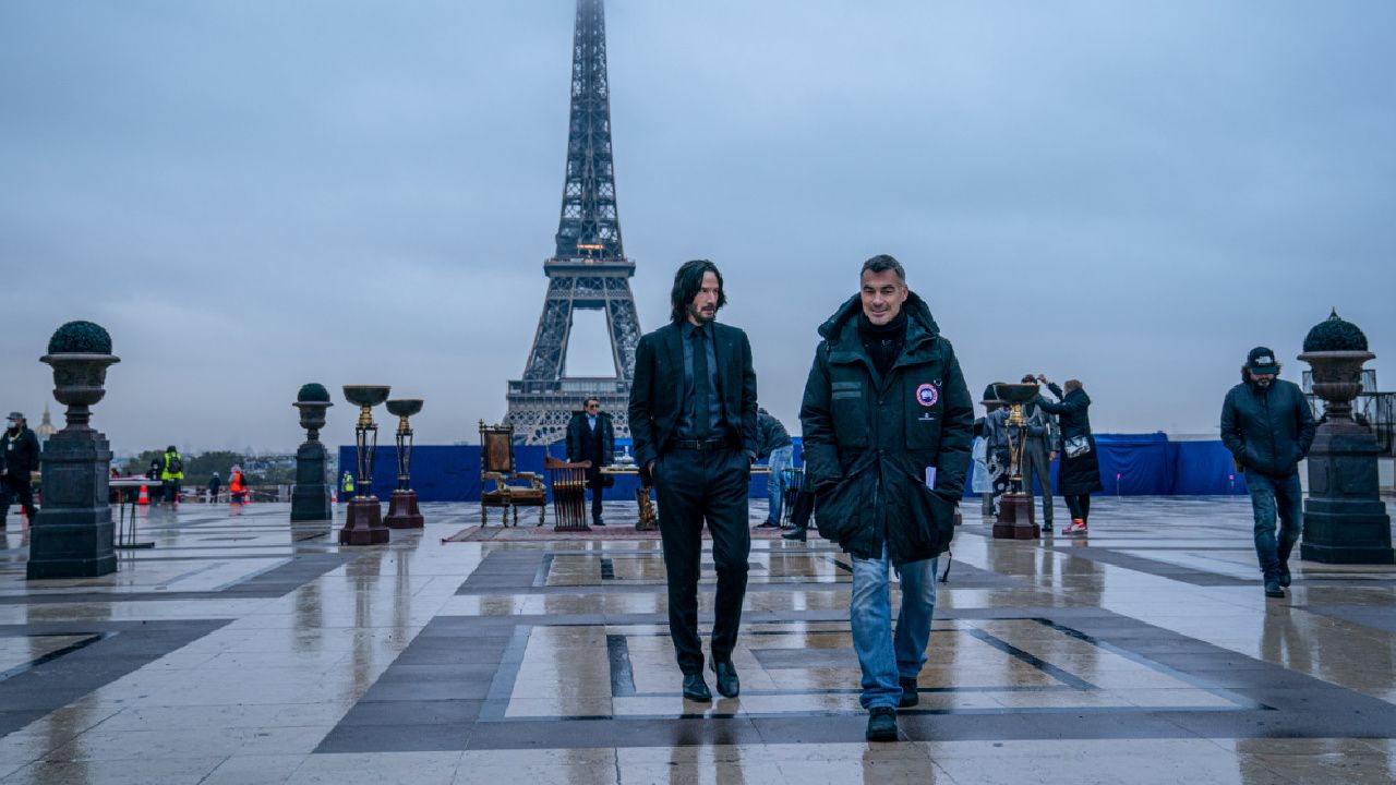 (L to R) Ian McShane as Winston, Keanu Reeves as John Wick, and director Chad Stahelski on the set of 'John Wick: Chapter 4.' Photo Credit: Murray Close.