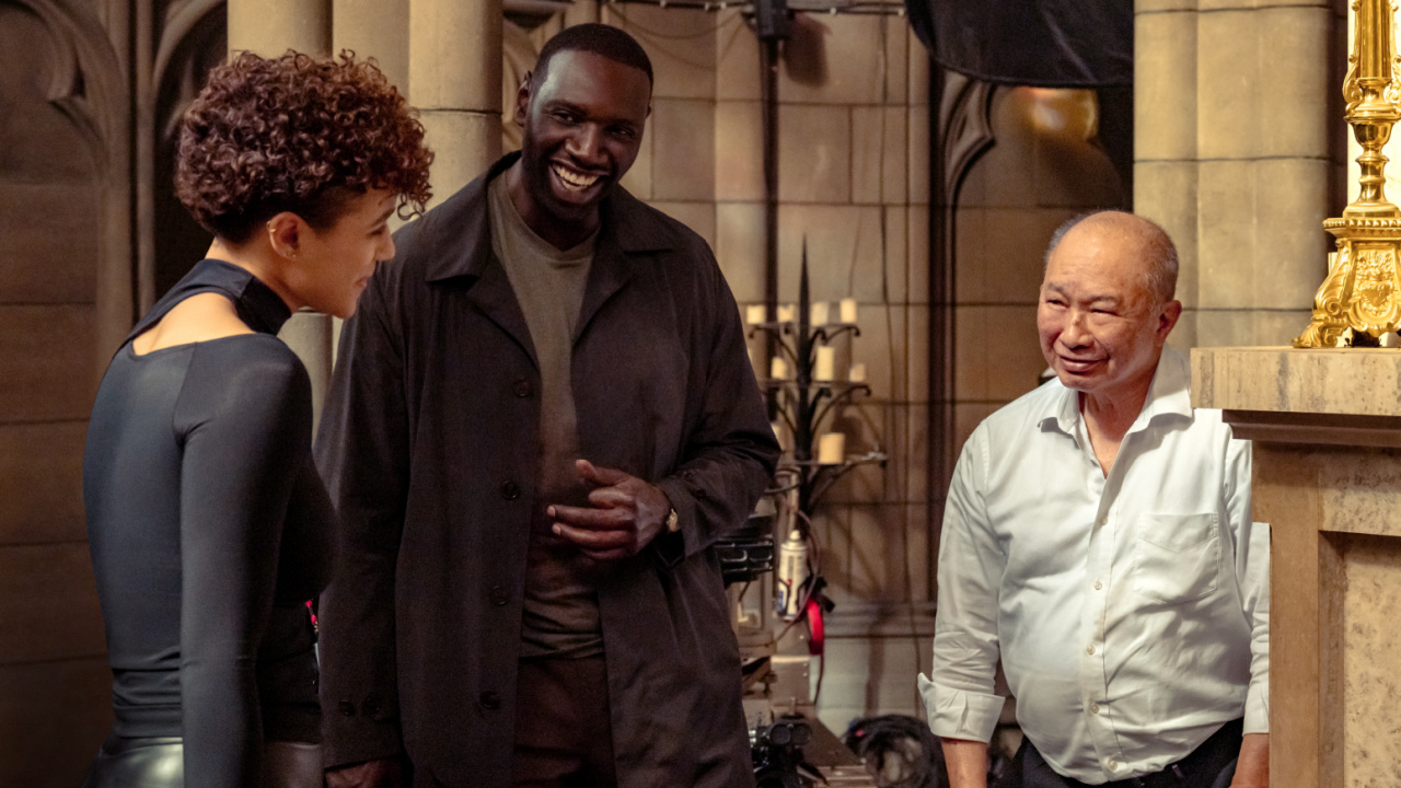 (L to R) Nathalie Emmanuel, Omar Sy and director John Woo on the set of 'The Killer'. Photo: Peacock.