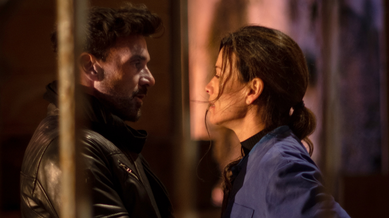 (L to R) Frank Grillo as “Ryder” and Rhona Mitra as “Selina” in the action/thriller/war film, 'Hounds of War', an XYZ Films release. Photo courtesy of XYZ Films.