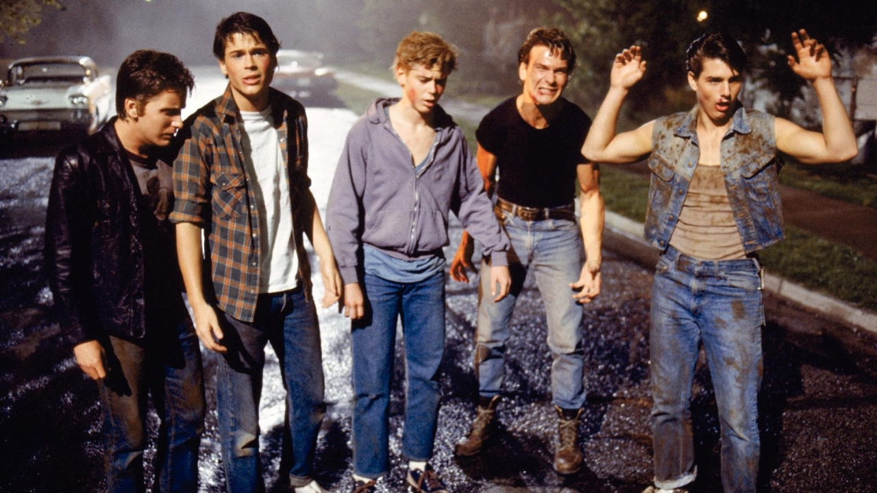 (L to R) Emilio Estevez, Rob Lowe, C. Thomas Howell, Patrick Swayze and Ralph Macchio in 'The Outsiders'. Photo: Warner Bros.