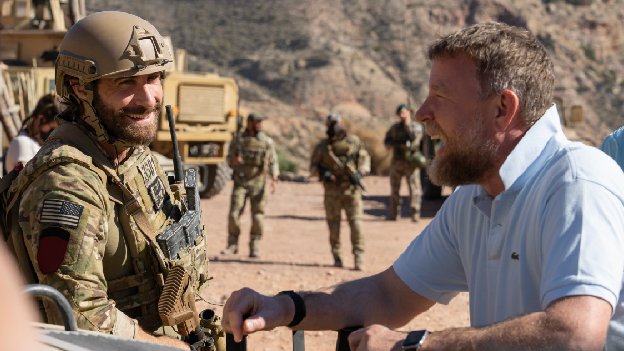 Actor Jake Gyllenhaal (left) and director Guy Ritchie (right) on the set of 'The Covenant,' a Metro Goldwyn Mayer Pictures film. Credit: Christopher Raphael / Metro Goldwyn Mayer Pictures.