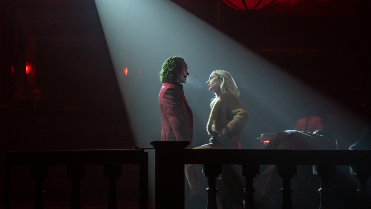 (L to R) Joaquin Phoenix as Arthur Fleck/Joker and Lady Gaga as Lee Quinzel in Warner Bros. Pictures’ 'Joker: Folie à Deux,' a Warner Bros. Pictures release. Photo Credit: Niko Tavernise. Copyright: © 2024 Warner Bros. Entertainment Inc. All Rights Reserved.