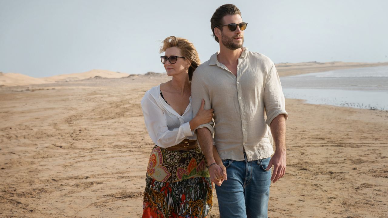 (L to R) Laura Dern as Katherine Loewe and Liam Hemsworth as Owen Brophy in 'Lonely Planet'. Photo: Hilary Bronwyn Gayle/Netflix © 2024.