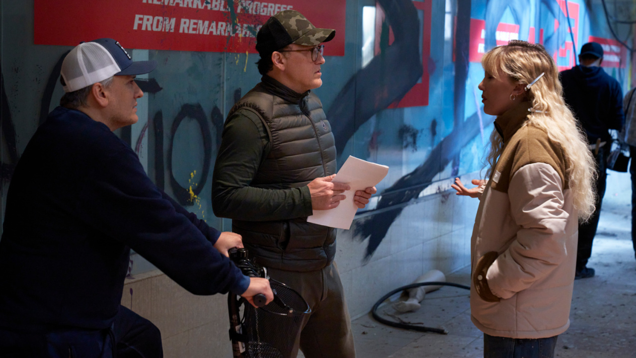 (L to R) Joe Russo (Director), Anthony Russo (Director) and Millie Bobby Brown as Michelle on the set of 'The Electric State'. Photo: Paul Abell, ©2024 Netflix, Inc.