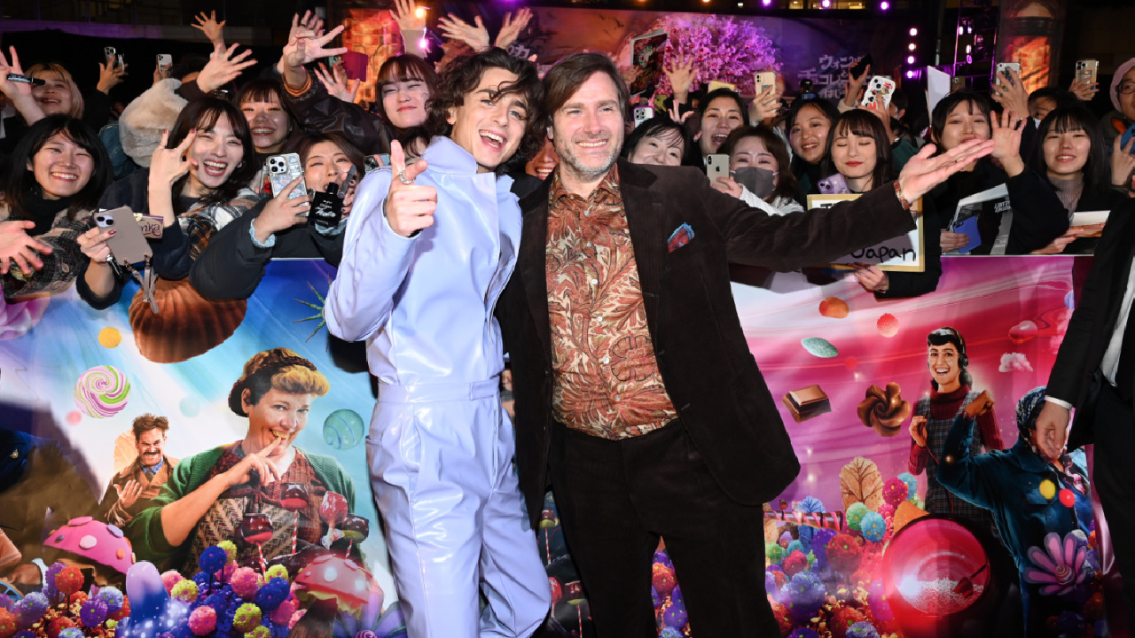 (Left to right) Timothee Chalamet and director Pau King at a fan event for “Wonka.” Photo credit: Courtesy of Warner Bros. Pictures. Copyright: © 2023 Warner Bros. Entertainment Inc. All rights reserved.