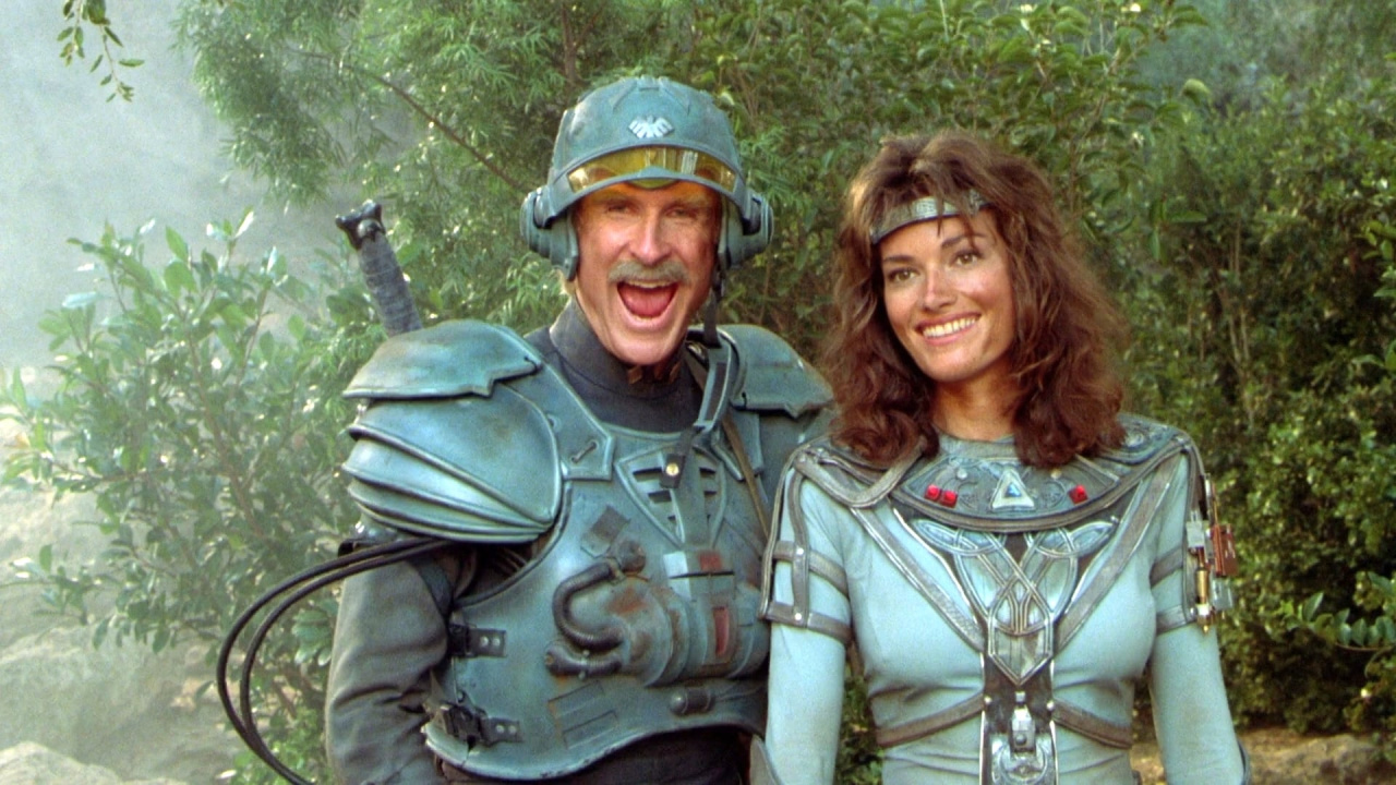 (L to R) Jon Cypher as Man-At-Arms and Chelsea Field as Teela in 'Masters of the Universe'. Photo: The Cannon Group, Inc.