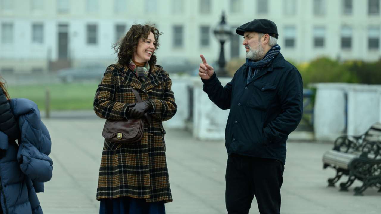 (L to R) Olivia Colman and Sam Mendes on set of the film 'Empire of the Light.' Photo by Parisa Taghizadeh, Courtesy of Searchlight Pictures. © 2022 20th Century Studios All Rights Reserved.