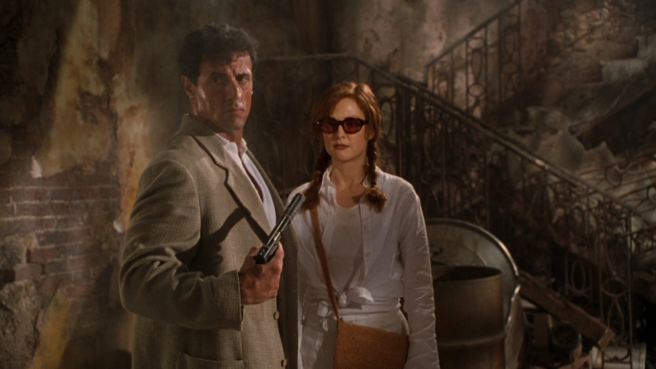 (L to R) Sylvester Stallone and Julianne Moore in 'Assassins'. Photo: Warner Bros.