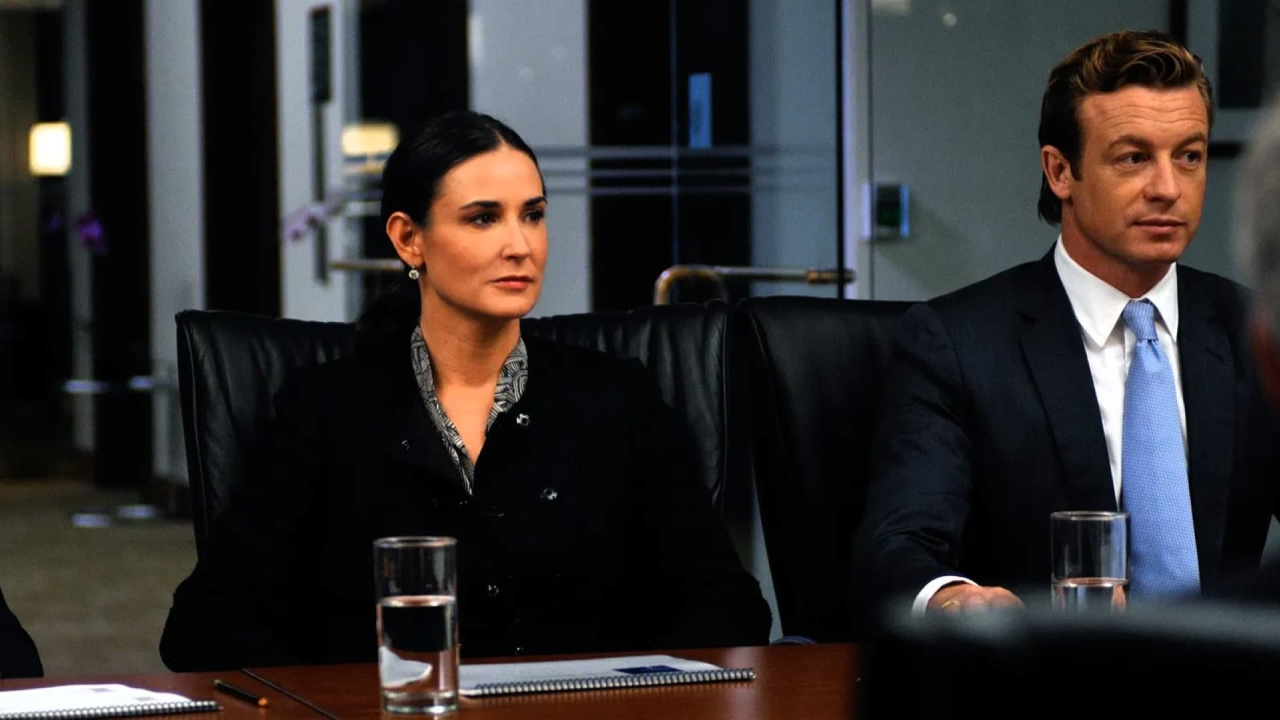 (L to R) Demi Moore and Simon Baker in 'Margin Call'. Photo: Lionsgate and Roadside Attractions.