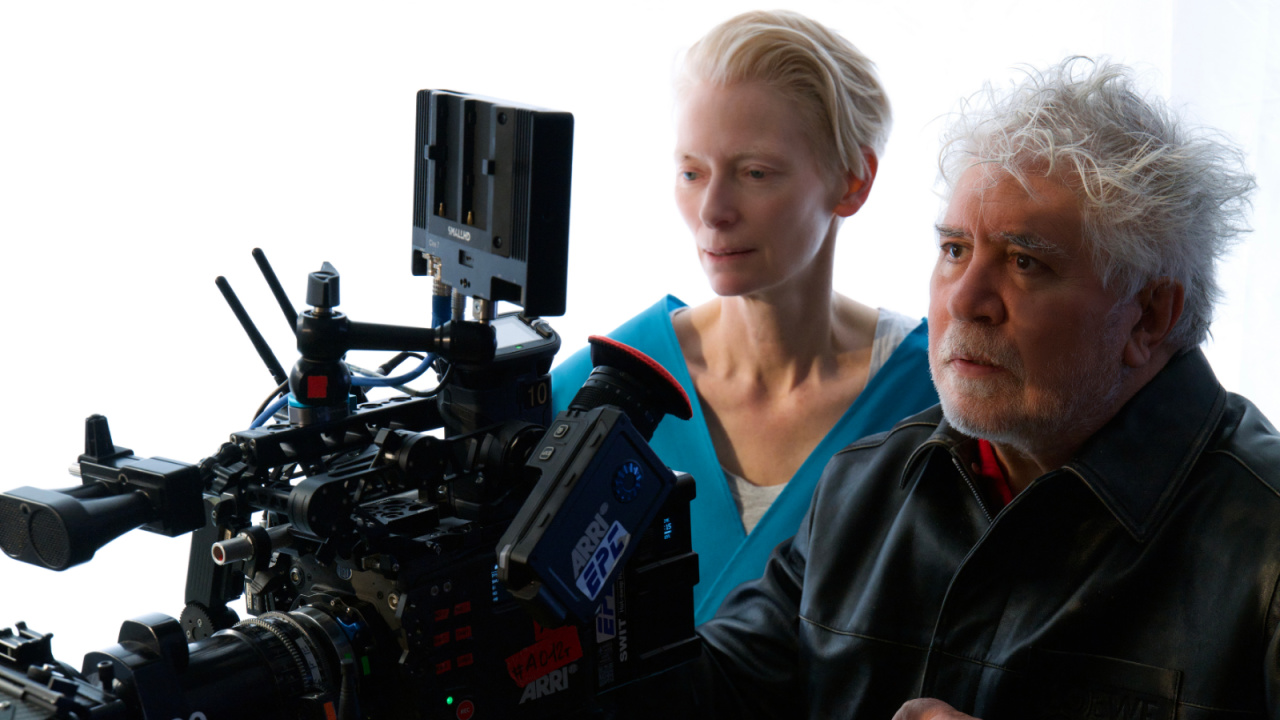 (L to R) Tilda Swinton and director Pedro Almodóvar in 'The Room Next Door'. Photo: Warner Bros. Pictures.