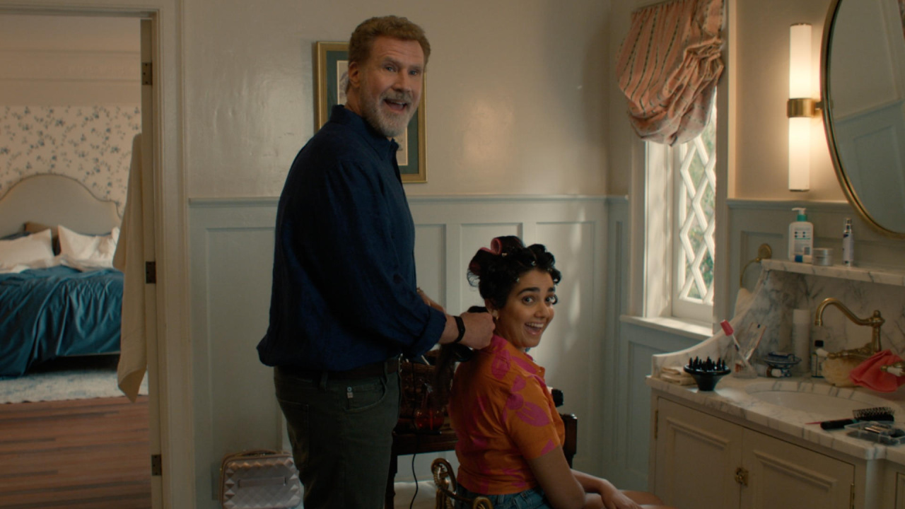 (L to R) Will Ferrell and Geraldine Viswanathan in 'You're Cordially Invited'. Photo Credit: Glen Wilson/Prime Video. Copyright: © 2023 Amazon Content Services LLC.