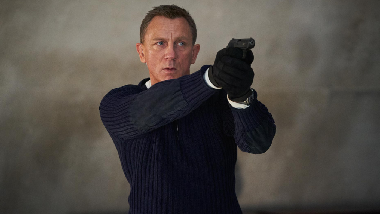 James Bond (Daniel Craig) prepares to shoot in 'No Time To Die,' a Metro Goldwyn Mayer Pictures film.