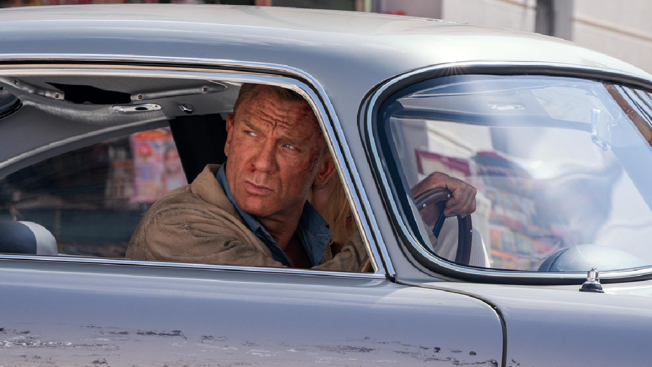 (L to R) James Bond (Daniel Craig) and Dr. Madeleine Swann (Léa Seydoux) drive through Matera, Italy in 'No Time To Die,'