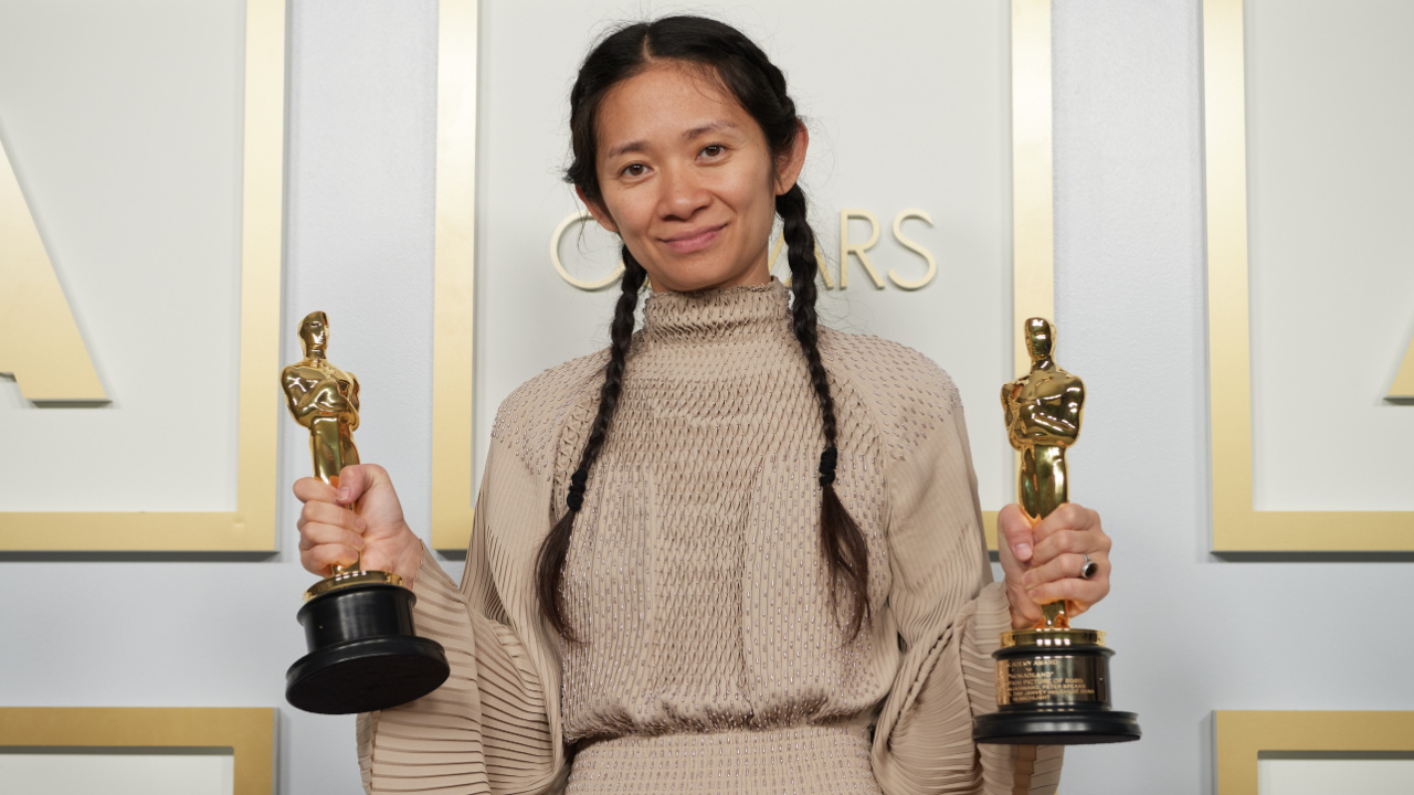 Chloé Zhao poses backstage with the Oscars® for Directing and Best Picture the during the live ABC Telecast of The 93rd Oscars® at Union Station in Los Angeles, CA on Sunday, April 25, 2021. Credit/Provider: Matt Petit / A.M.P.A.S. Copyright: ©A.M.P.A.S.