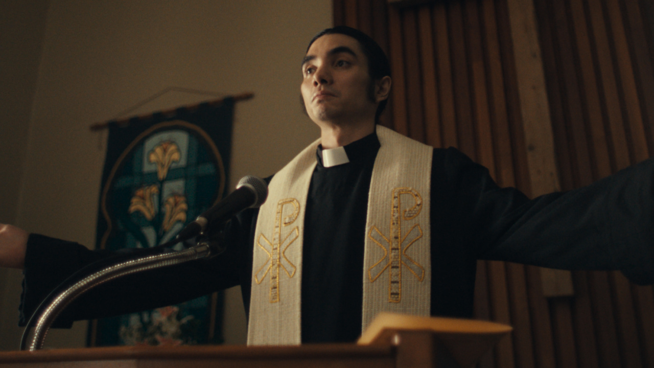 Nicco Del Rio as a pastor in 'The Monkey'. Photo: Neon.